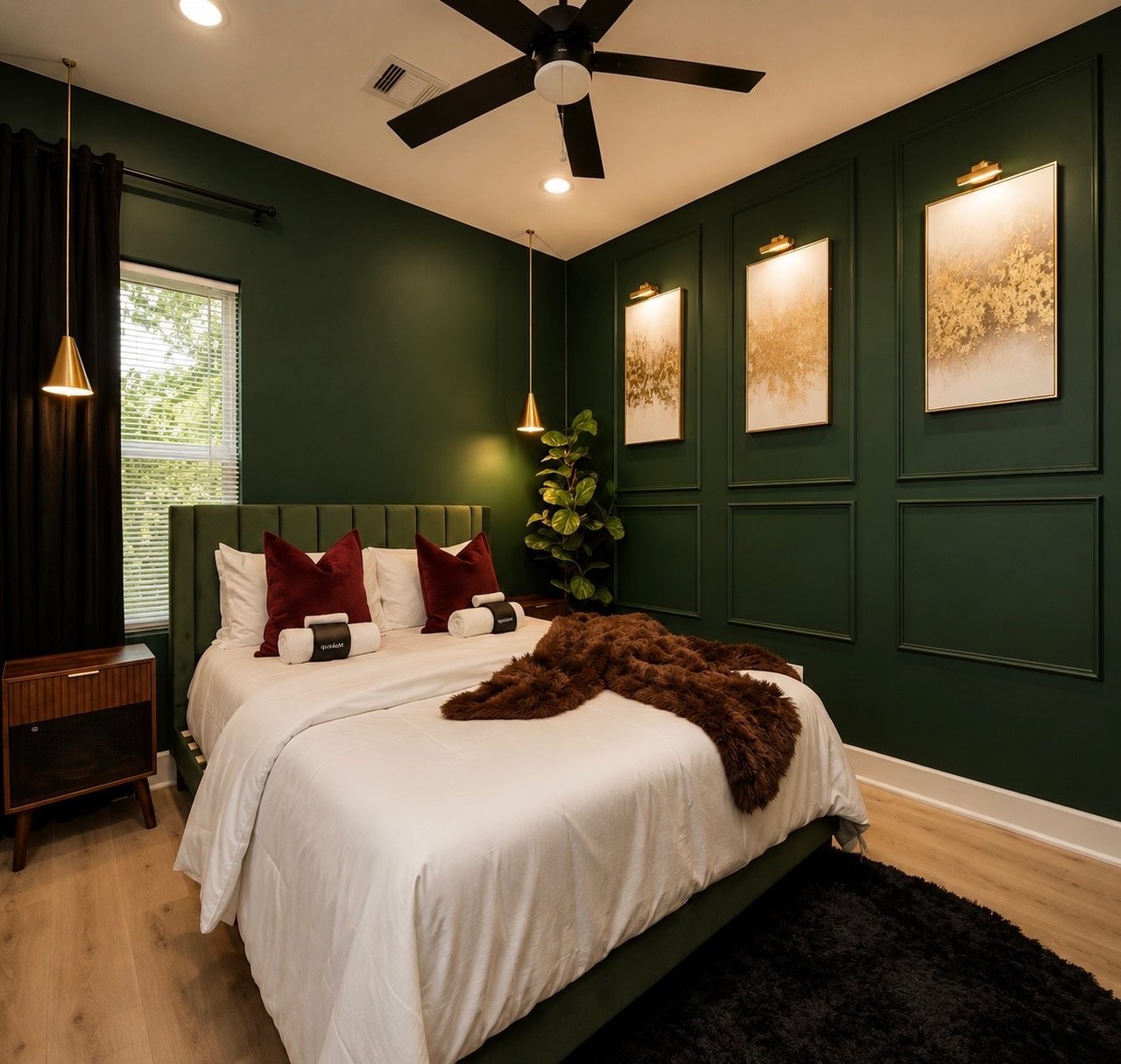 Forest green bedroom with brass pendants and layered bedding